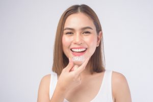 woman smiling with invisalign