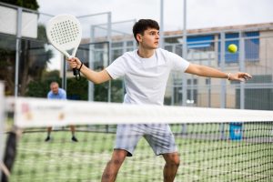 young man playing tennis