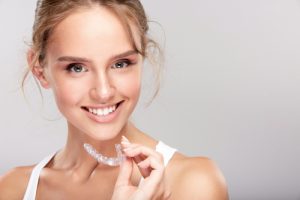 woman with invisalign aligner